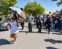 Dancer Dada and New Orleans style marching band lead the demonstration Dancer Dada and New Orleans style marching band lead the demonstration