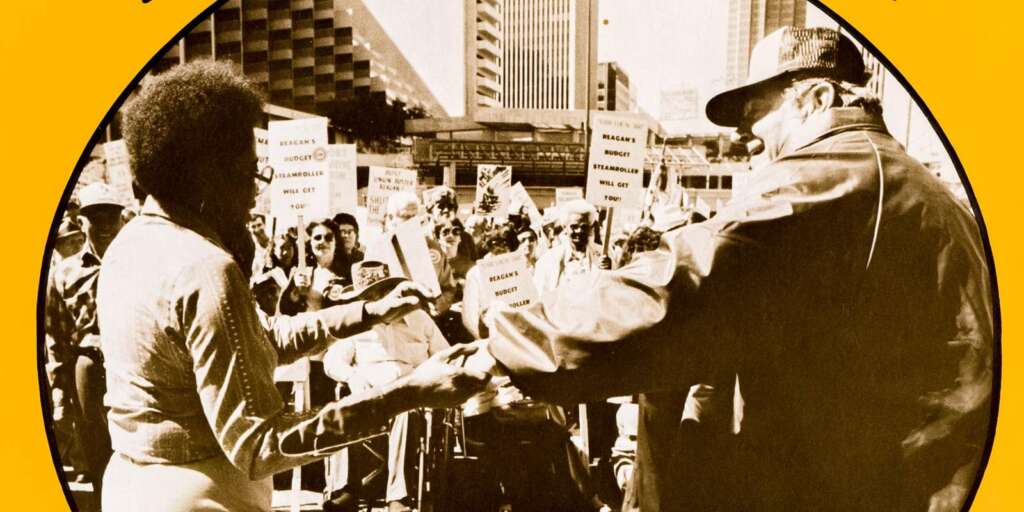 black woman and white worker dancing together