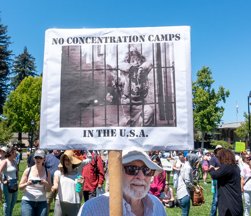 Photograph of young child behind bars