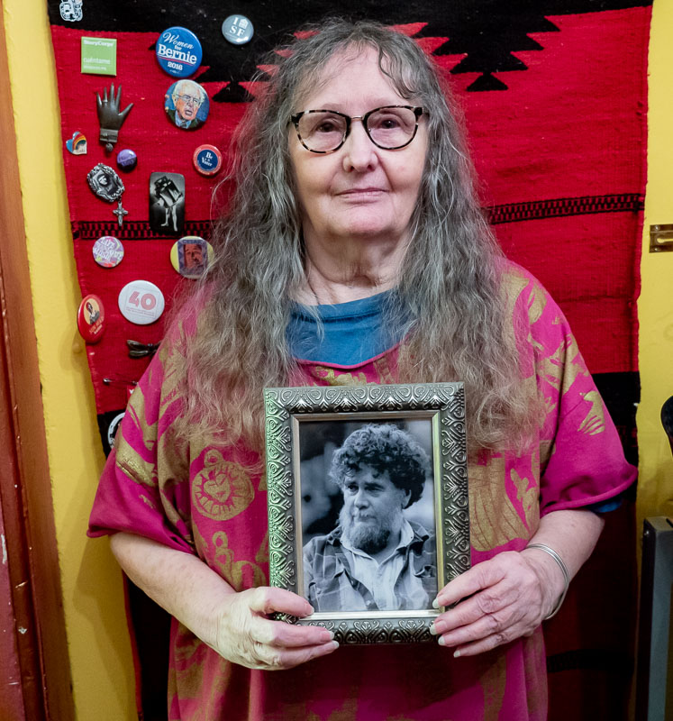 Linda holding aa photograph of her brother